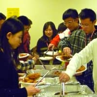 <p>Students from Beijing sample American food at Greenwich High School during Tuesday&#x27;s cultural meeting.</p>