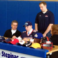 <p>Archbishop Stepinac High School quarterback Danny Hoffer signs his letter of intent to the University of Maine.</p>