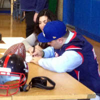 <p>Archbishop Stepinac High School offensive lineman Dan Pomposello signs his letter of intent to the University of New Haven.</p>