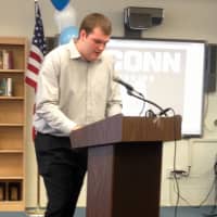 <p>Westlake High School football player Tommy Hopkins spoke to the crowd in the school library on Wednesday.</p>