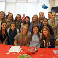<p>Members of Lakeland High School&#x27;s field hockey team support (seated from L-R) Kristen Conroy, Rebecca Bard and Gianna Bensaia.</p>