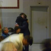 <p>Lou Christiansen and Chris Mancini hug following Mancini&#x27;s speech at Thursday&#x27;s drug action forum in Yorktown.</p>