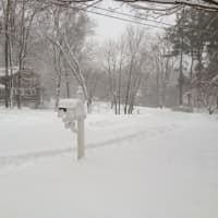 <p>Few cars used village streets Friday afternoon in Briarcliff Manor as the snow piled up. </p>