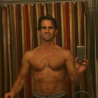 <p>Mike Cola posted a picture of himself at 49 on his personal fitness website Fitness Contrarian. His body here, he said, was achieved by training only three times per week. </p>