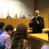<p>Yorktown Justice Sal Lagonia imparts his knowledge on the youth court graduates Wednesday night.</p>