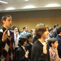 <p>Yorktown Youth Court graduates take an oath Wednesday night.</p>
