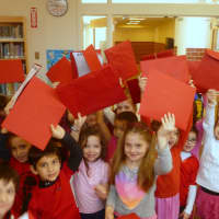 <p>Pound Ridge Elementary students show their enthusiasm for the Valentine&#x27;s Day Book Exchange.</p>
