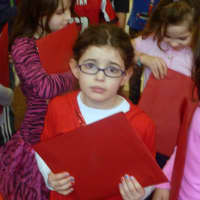 <p>First-grader Riley Benson nervously awaits the start of the Book Exchange.</p>