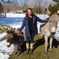 <p>Bethany Zaro of New Canaan stands with her donkeys Chipper, left, and Poppy. Chipper has recovered after being attacked by a pair of dogs last month. </p>