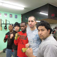 <p>From left: Be First Boxing Executive Director Wes Artope, boxer Oman Hassan, boxer Krashna Gibbs, boxer Adam Hassan, and coach Marcus Serrano.</p>