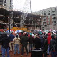 <p>A crowd of Connecticut construction workers join together outside a Stamford site where out-of-state workers have been hired.</p>