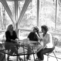 <p>Toppel, second from right, meets with her co-authors during a writers&#x27; workshop.</p>
