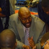<p>Clark Academy coach Anthony Gaines talks to his players before the game against Martin Luther King.</p>