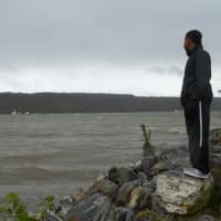 <p>Roemelle Douglas, 17, looks out over the Hudson River earlier this year. It&#x27;s views of the Palisades like this that Yonkers residents say might soon be interrupted should LG Electronics build a high-rise building in Englewood Cliffs, N.J. </p>