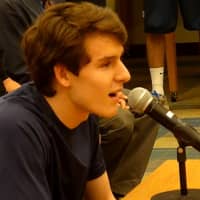 <p>Weston High School&#x27;s Charlie DiPasquale, a senior co-captain on the boys basketball team, speaks in support of former coach Mike Hvizdo at Monday&#x27;s Board of Education meeting.</p>