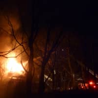 <p>Firefighters battle a two-alarm blaze Monday night in Yonkers. </p>