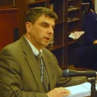 <p>Michael Jumper, assistant superintendent for business, addresses the school board.</p>
