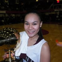 <p>Ossining senior and captain Danielle Gervacio holds the gold ball after the Pride defeated Our Lady of Lourdes, 83-51 Sunday for their third consecutive Section 1 Class AA championship.</p>