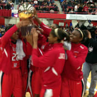 <p>The Peekskill High School girls basketball team hoists the gold ball after their win in the Section 1 Class A championship game.</p>