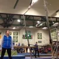 <p>Fairfield Ludlowe gymnast Perry Kindel competes on the uneven bars at a recent meet.</p>
