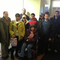 <p>SPARC Inc. members gather at the Hudson Valley Pet Food Pantry to donate food they collected throughout February. </p>