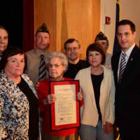 <p>Robert Perry&#x27;s daughter, front left, and wife, holding the plaque, accepted the induction on behalf of the late Yorktown World War II veteran.</p>