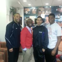 <p>The New Rochelle boys basketball players and coach with actor Taye Diggs.</p>
