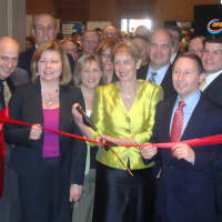 <p>Marsha Gordon, surrounded by fellow members of the Business Council of Westchester, cuts the ribbon at the start of the Mega Mixer Business Expo in Port Chester.</p>