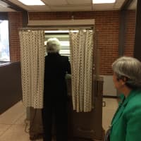 <p>Carolyn Steigmeier, a longtime election inspector, votes Tuesday in Scarsdale. </p>