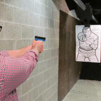 <p>One of the adult students in the Darien Police Department shooting range during the recent Citizen&#x27;s Police Academy.</p>
