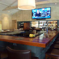 <p>The bar at 323 Main in Westport was carved from African Moabi wood.</p>