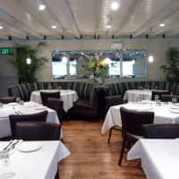 <p>The dining room at 323 Main in Westport includes a mix of booth and table seats.</p>