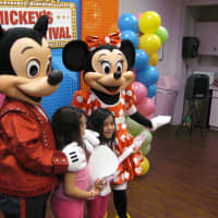 <p>After making paper air guitars, kids meet Mickey and Minnie and get their pictures taken.</p>
