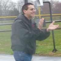 <p>Mark Pastor cheers runners on at the Race For Dare in Easton in 2011.</p>