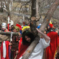 <p>Father Vincent Druding (Jesus) and members of the Assumption Catholic Church congregation carried out a live reenactment of the crucifixion of Jesus on Good Friday,</p>