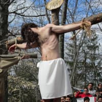 <p>Father Vincent Druding (Jesus) and members of the Assumption Catholic Church congregation carried out a live reenactment of the crucifixion of Jesus on Good Friday,</p>