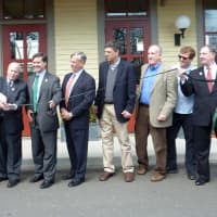 <p>State and local officials, including Gov. Dannel Malloy (l), First Selectman Gordon Joseloff (2nd l) and Westport state Rep. Jonathan Steinberg, (r), celebrate the new solar hub at the Westport train station with a ribbon cutting Monday.</p>