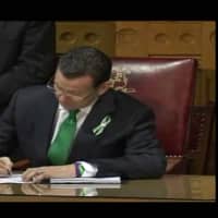 <p>Connecticut Gov. Dannel Malloy signs stricter gun control measures into law in Hartford on Thursday. </p>