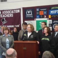<p>Karen Magee of the Harrison Association of Teachers talks about gun violence at the unveiling of a solidarity quilt for the Newtown community.</p>
