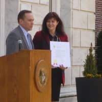 <p>Greenwich First Selectman Peter Tesei presents Arthur Murray Grande Ballroom of Greenwich president and owner Christine Georgopulo with a proclamation declaring April 4 &quot;Arthur Murray Day.&quot;</p>