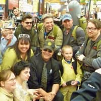 <p>Actor Dan Aykroyd, center with sunglasses and hat, poses with a group of &quot;Ghostbusters&quot; fans at his appearance at Total Wine and More in Nowalk.</p>
