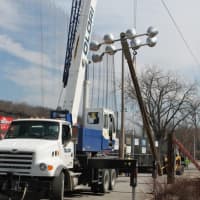 <p>A contractor takes down the remaining four field lights last week.</p>