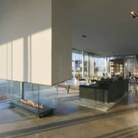 <p>Old Greenwich&#x27;s Spiral House has glass fireplaces and walls, giving an airy open feel throughout. </p>