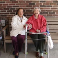<p>Phyllis Shearer and Dorothy MacLean sit on the new Pound Ridge senior citizens bench.</p>