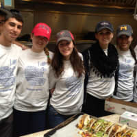 <p>From left, Conservative Synagogue congregants Jared Weisman, Andrew Cohen, Danielle Frost, Annie Cooperstone, Jessica Felton, Perri Cohen and Matthew Hodes volunteer to serve food at the Norwalk Emergency Shelter on April 7.</p>