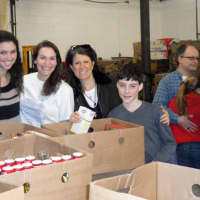 <p>From left. Rachel Labarre, Heather Millet, Emily Ceisler Blitzer and Jacob Wolfe sort food at the Connecticut Food Bank.</p>
