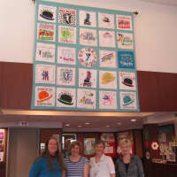 <p>A large team of Rye YMCA quilters created a special quilt in honor of the 25th Rye Derby. Seen here with the quilt are team members Ann Edmonds, Amy Katz, Penny Cozza and Kim Mulcahy</p>