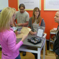 <p>Amy Guerrieri, far right, talks with a customer at GrassRxOOTS, the new vegan station at the Upper Crust Bagel Company in Old Greenwich. Employees Heath Duncan, left, and Jen Eazarsky look on.</p>