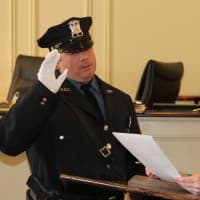 <p>Rye Police Sgt. Michael Anfuso is sworn in by City Clerk Dawn Nodarse.</p>