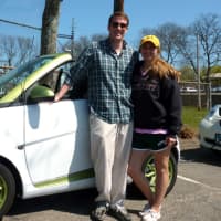 <p>Norwalk resident Kyle Smith and Alyssa Esposito of Shelton show off the 2nd generation Smart Car they drove Saturday in Westport&#x27;s first electric car rally and showcase.</p>